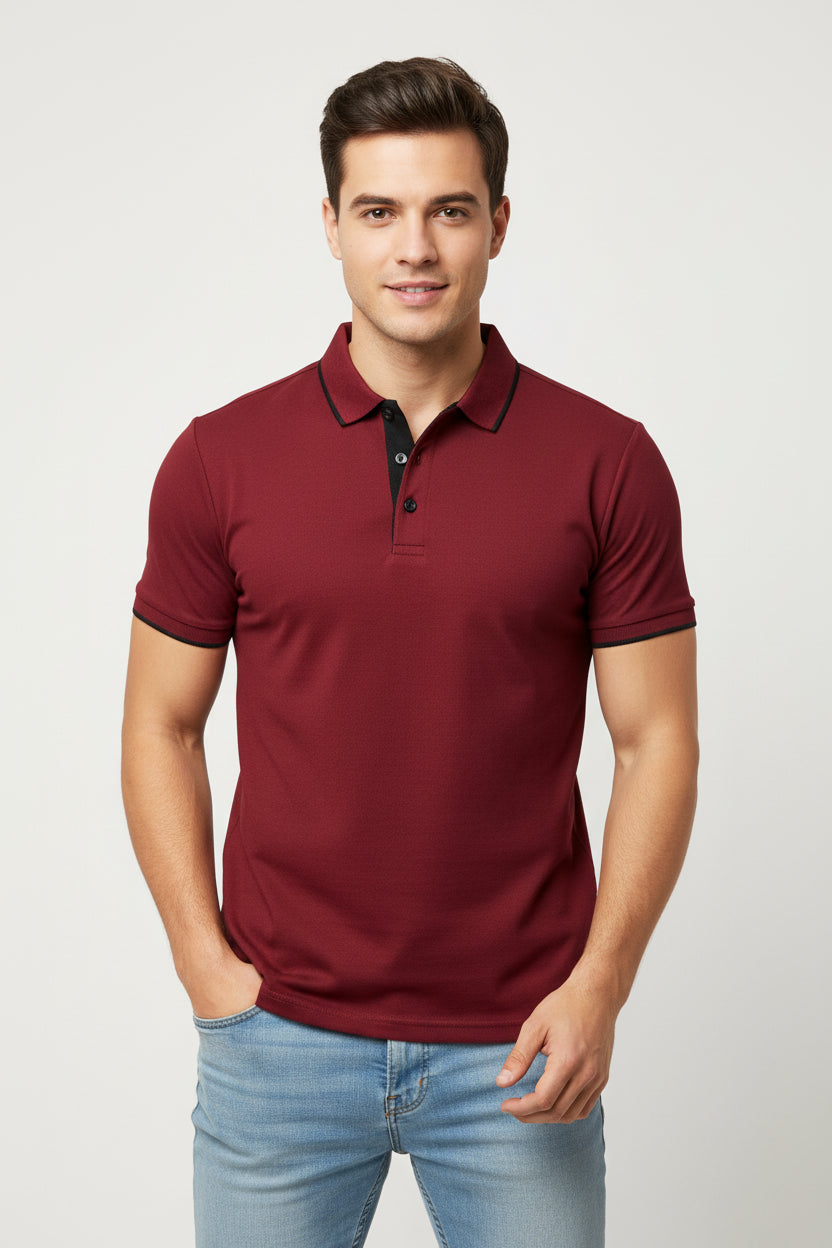 Red polo shirt with black trim on a white background
