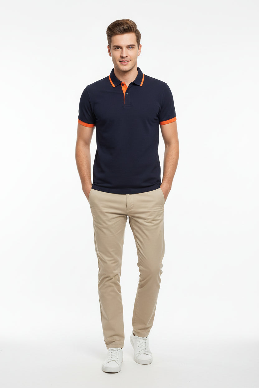 Navy blue polo shirt with orange accents on a white background