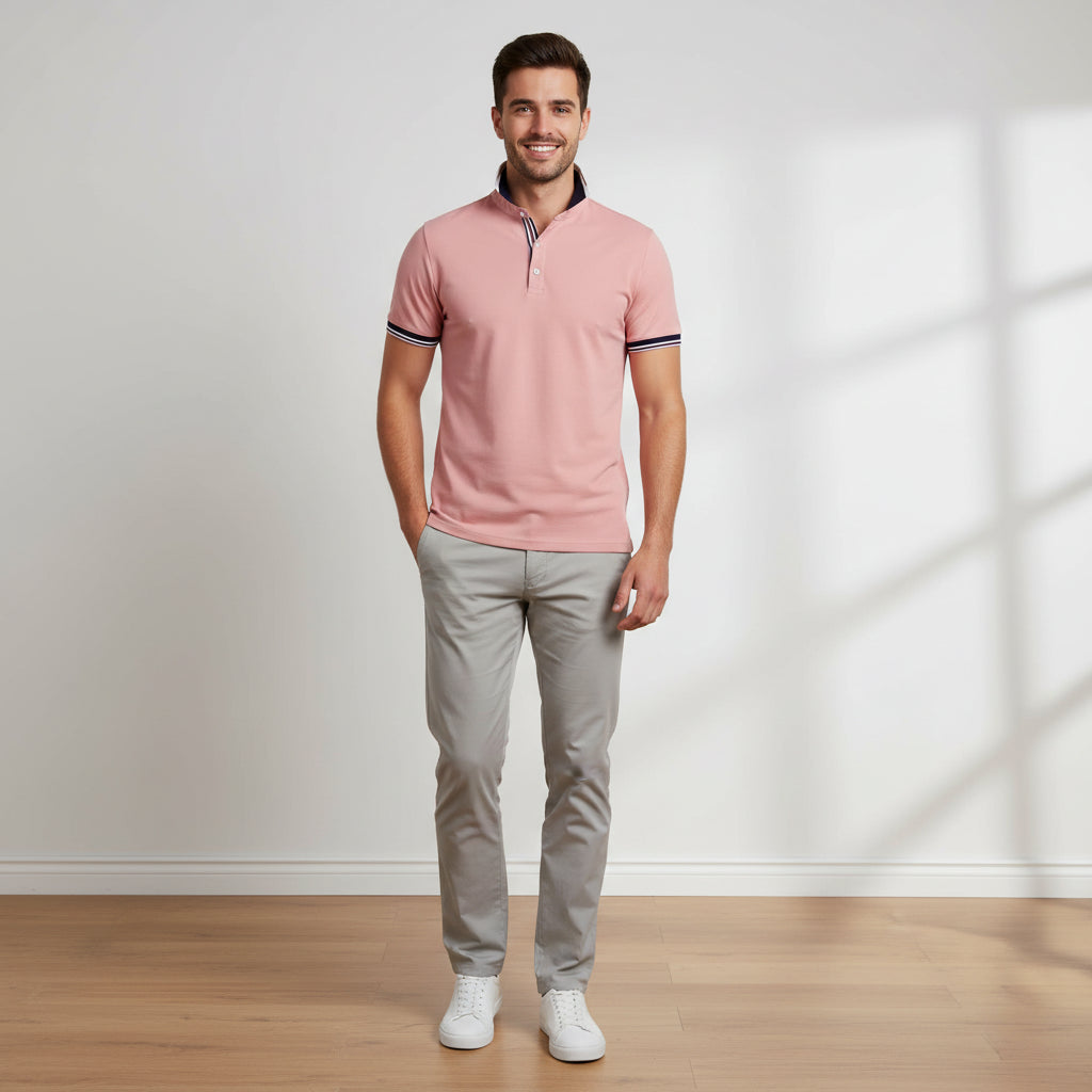 Pink polo shirt with white trim on a white background