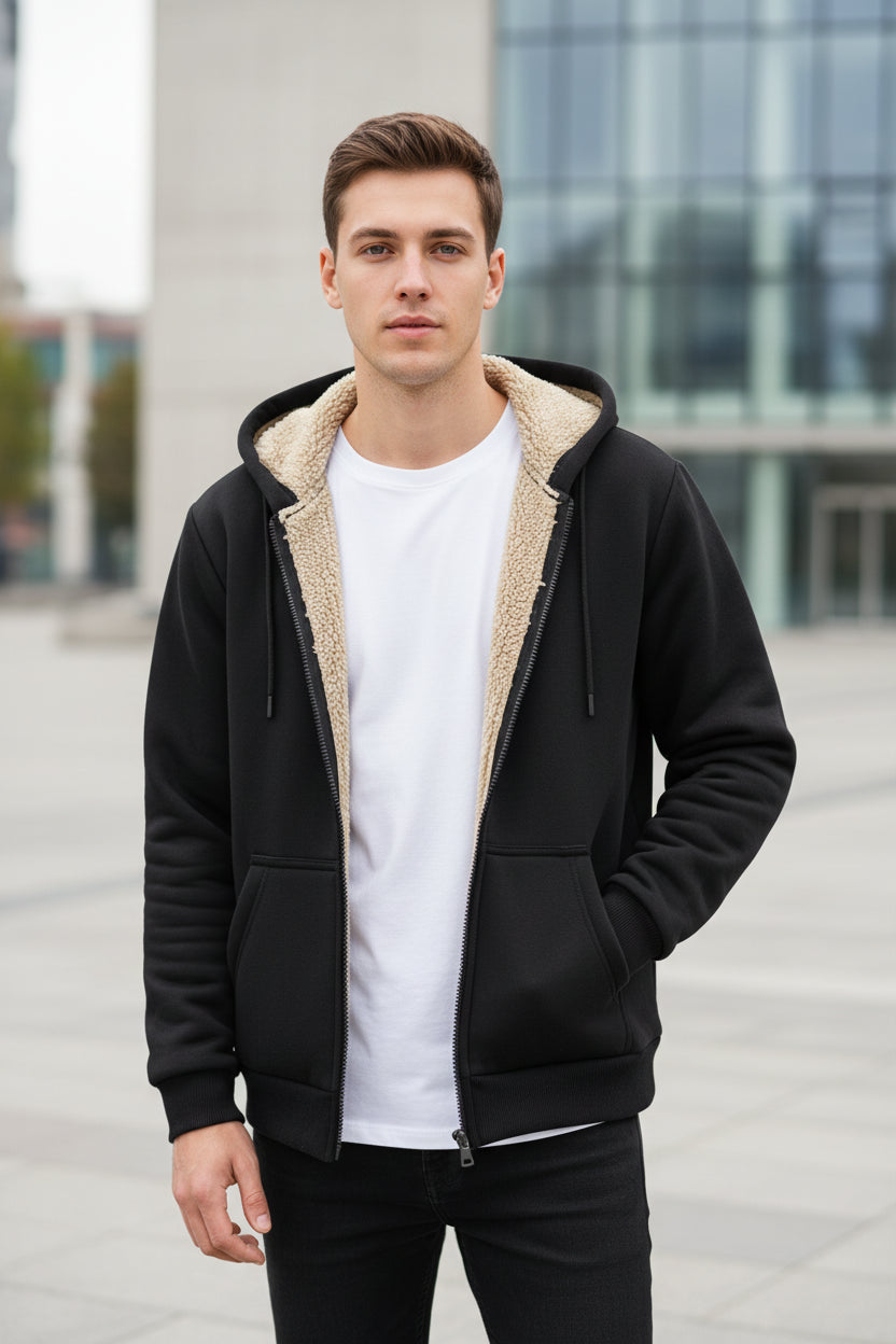 Black hoodie with white lining on a textured gray background