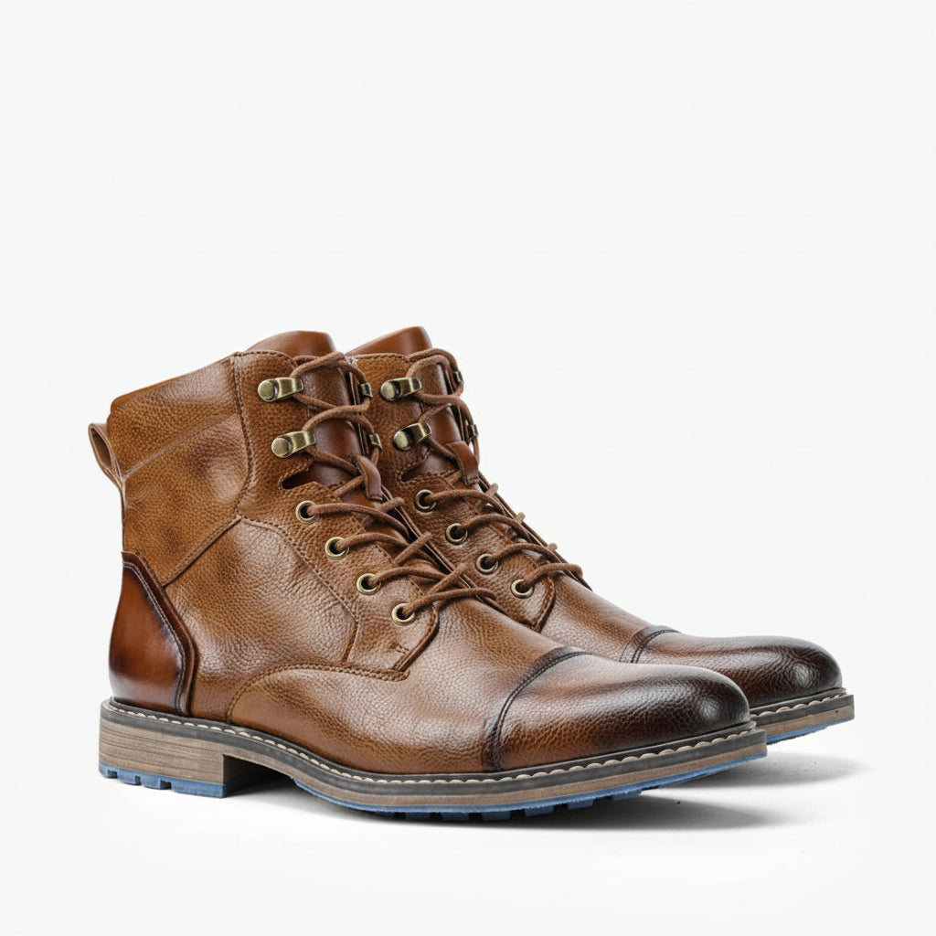 Pair of brown leather boots on a white background