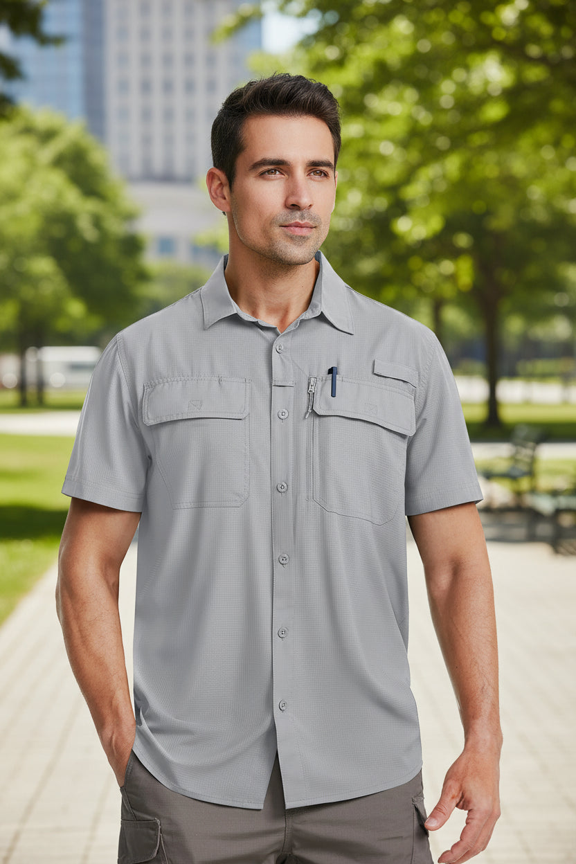 Man wearing a gray short-sleeve shirt with pockets on a white background