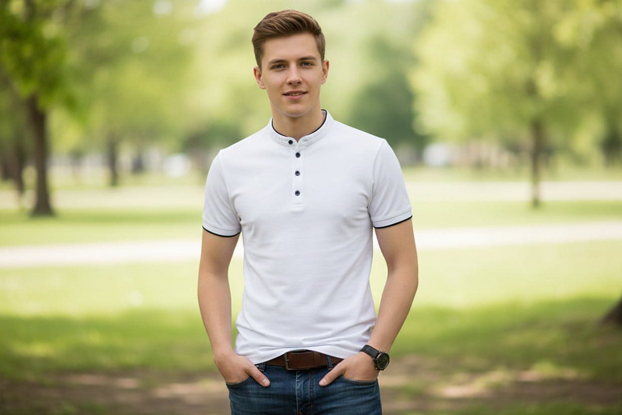 White short-sleeve shirt with black trim worn by a person on a gray background