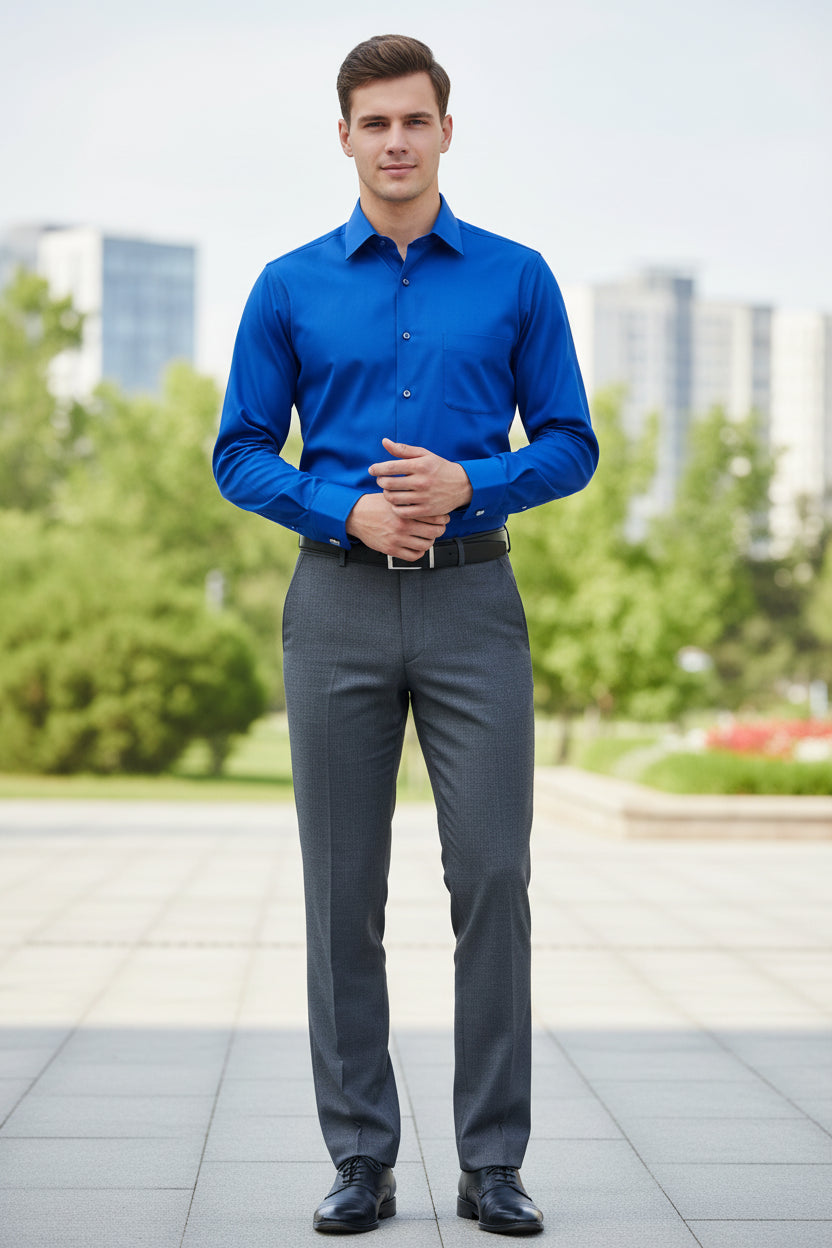 Folded blue dress shirt with cufflinks on a light gray background