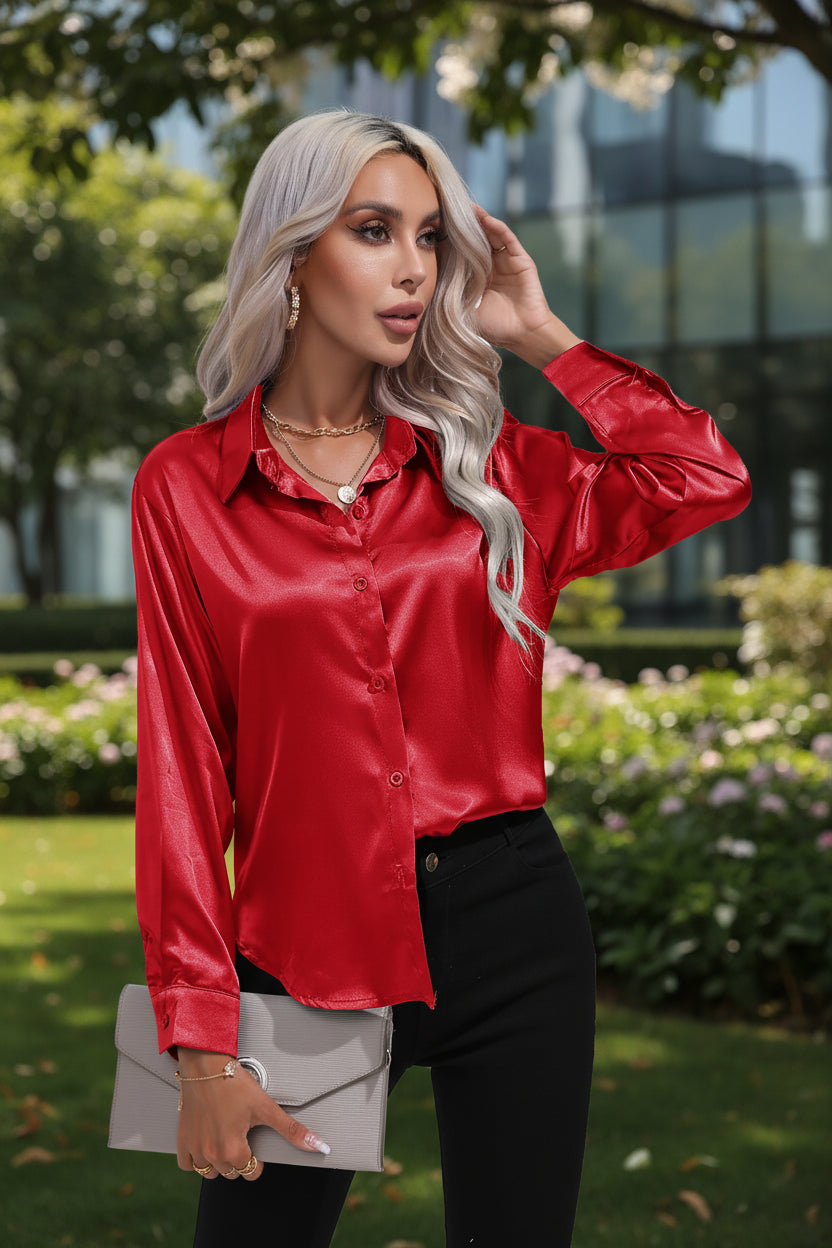Woman wearing a red satin shirt with a white background