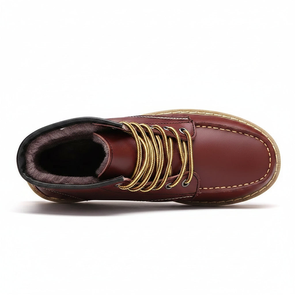 Brown leather boot with gold laces on a white background