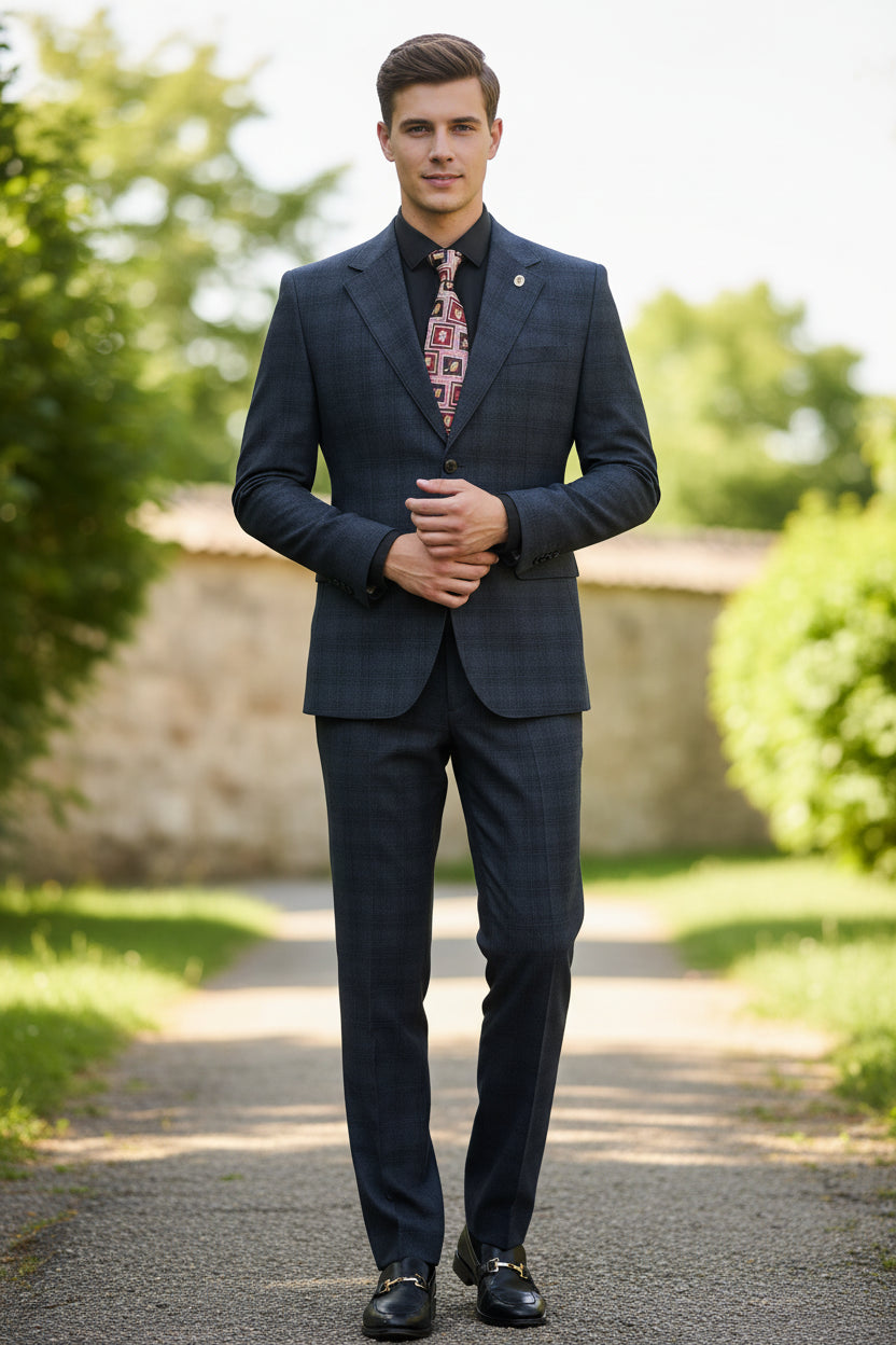 Gray suit on a mannequin with a patterned tie against a neutral background