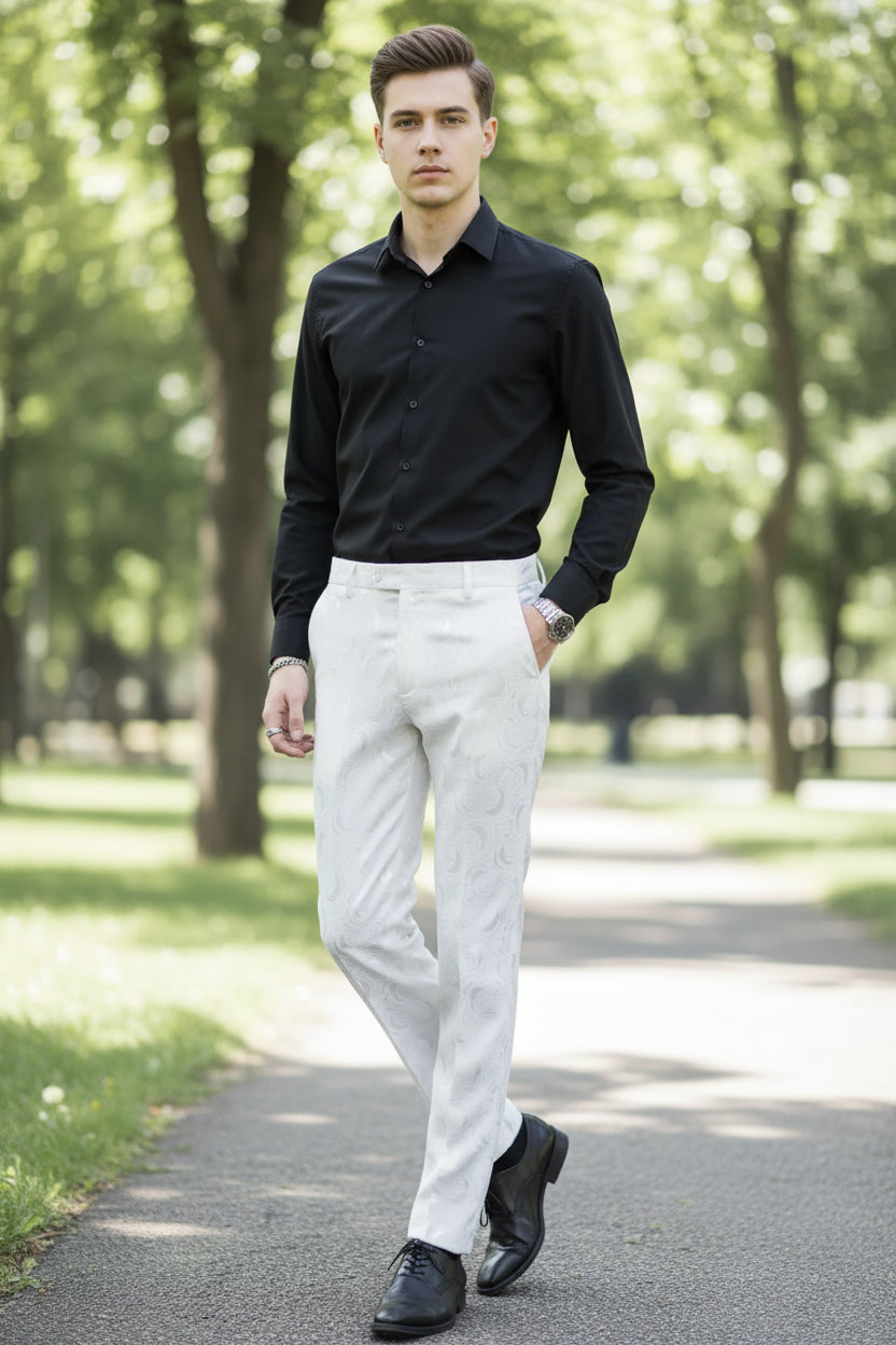 Person wearing white textured pants and black shoes in a room with wooden paneling.