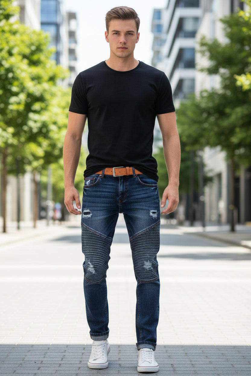 Blue jeans with patches on a wooden floor and cloudy sky background