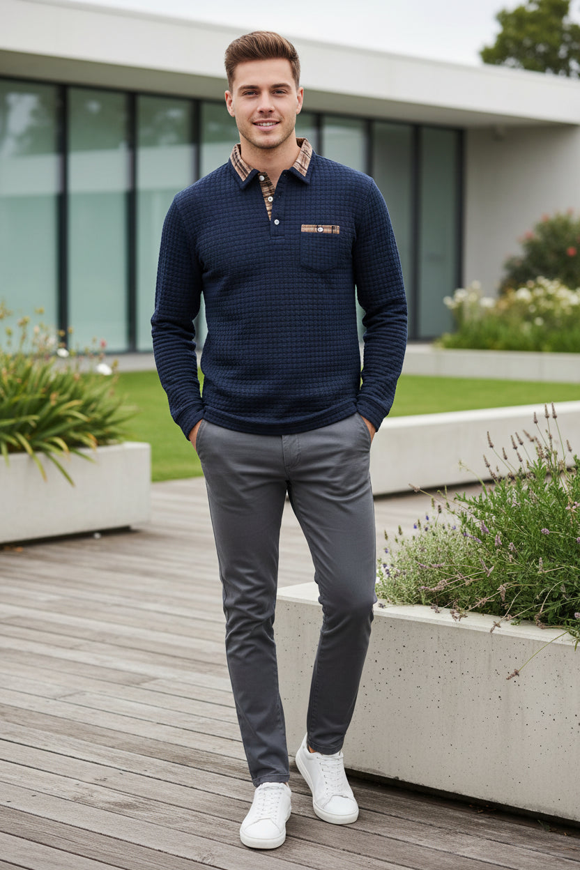 Navy blue textured sweater with plaid collar and pocket on a white background