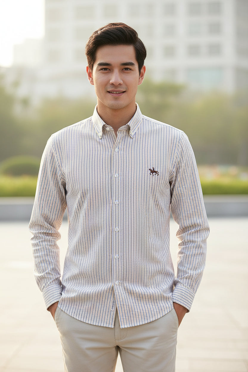 Folded striped shirt with a logo on a white background
