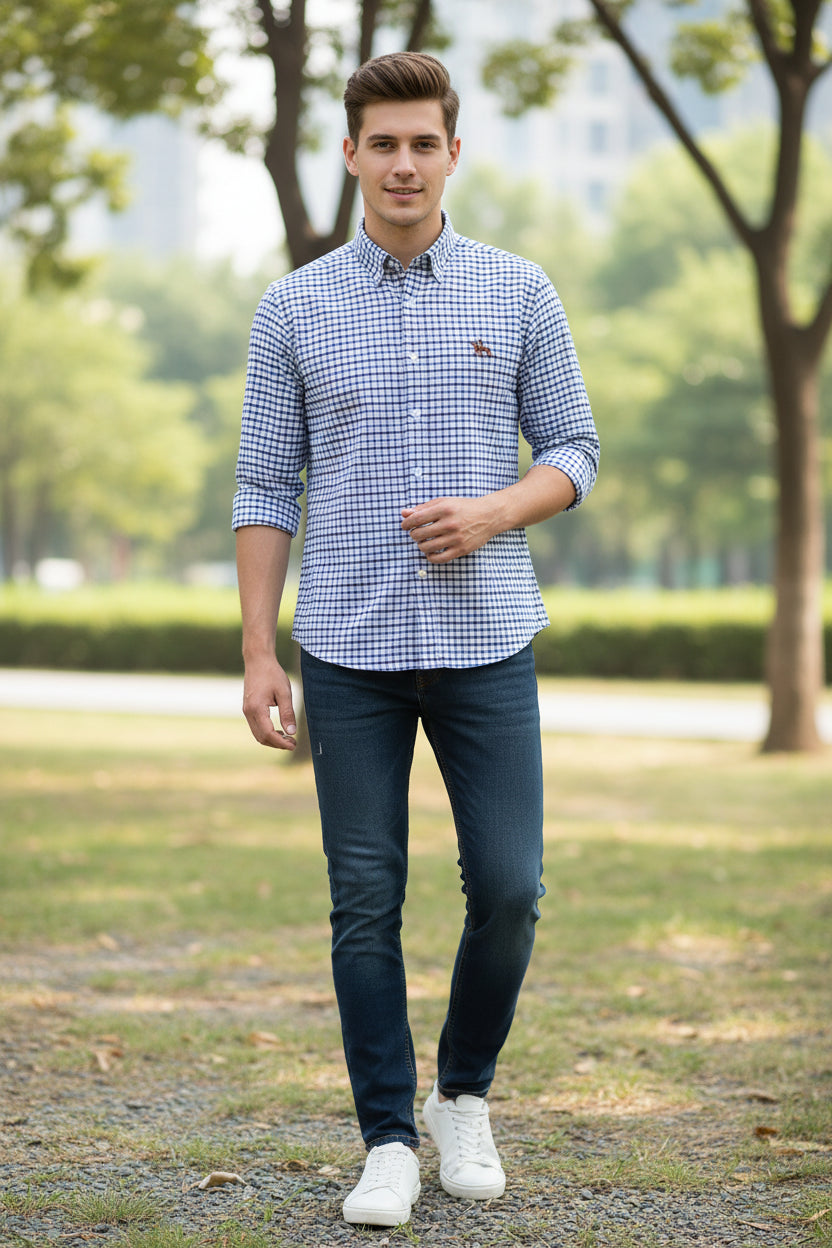Folded blue and white checkered shirt with a logo on a light gray background
