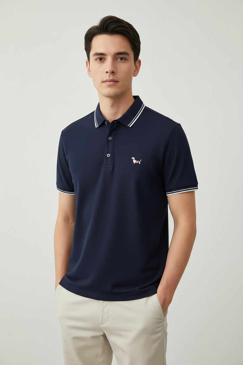 Navy blue polo shirt with white trim on a rack with other shirts in the background