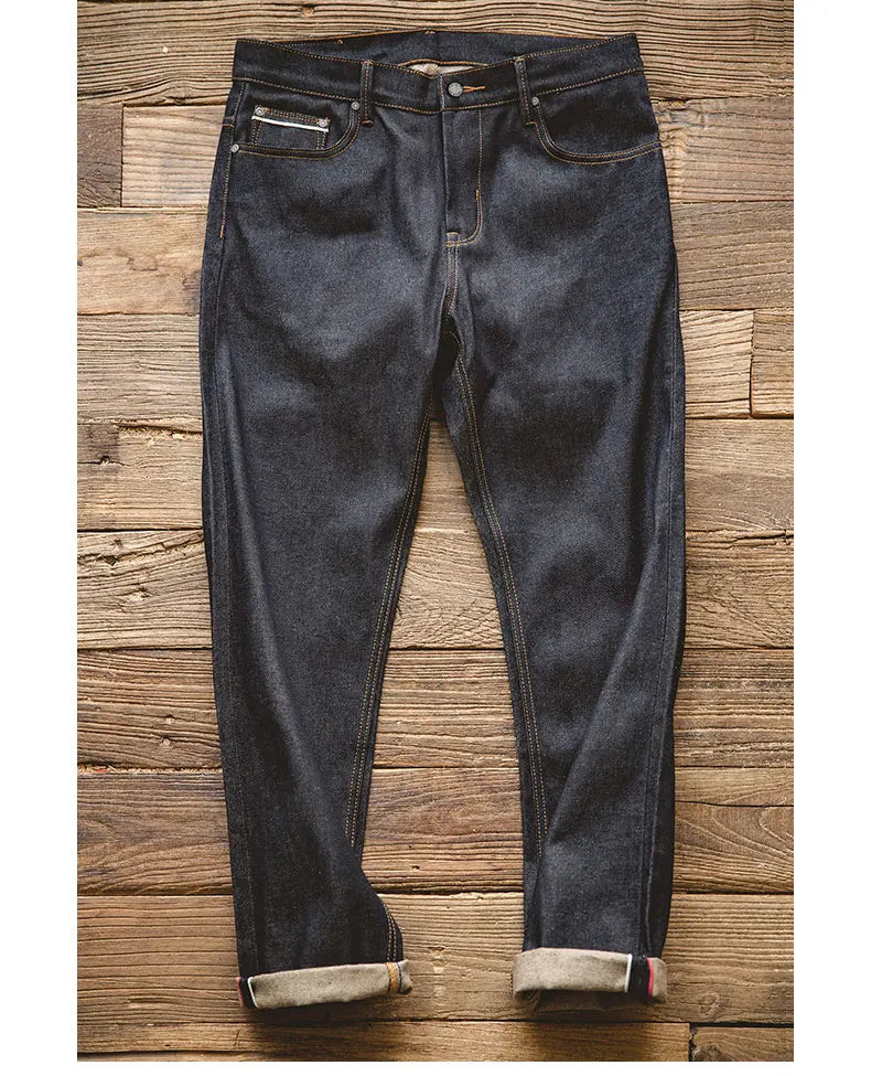 Dark blue jeans on a wooden surface