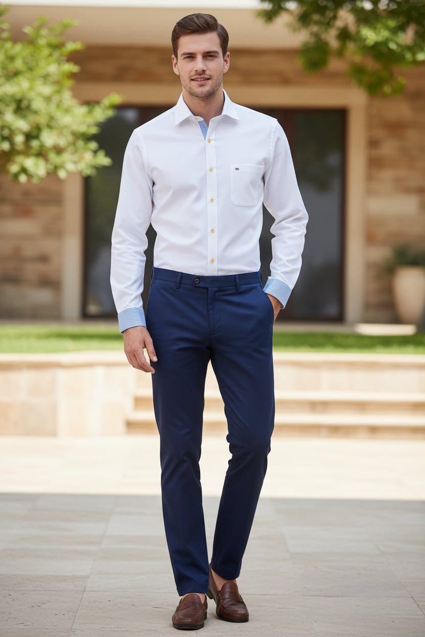 White dress shirt with blue collar on a white background