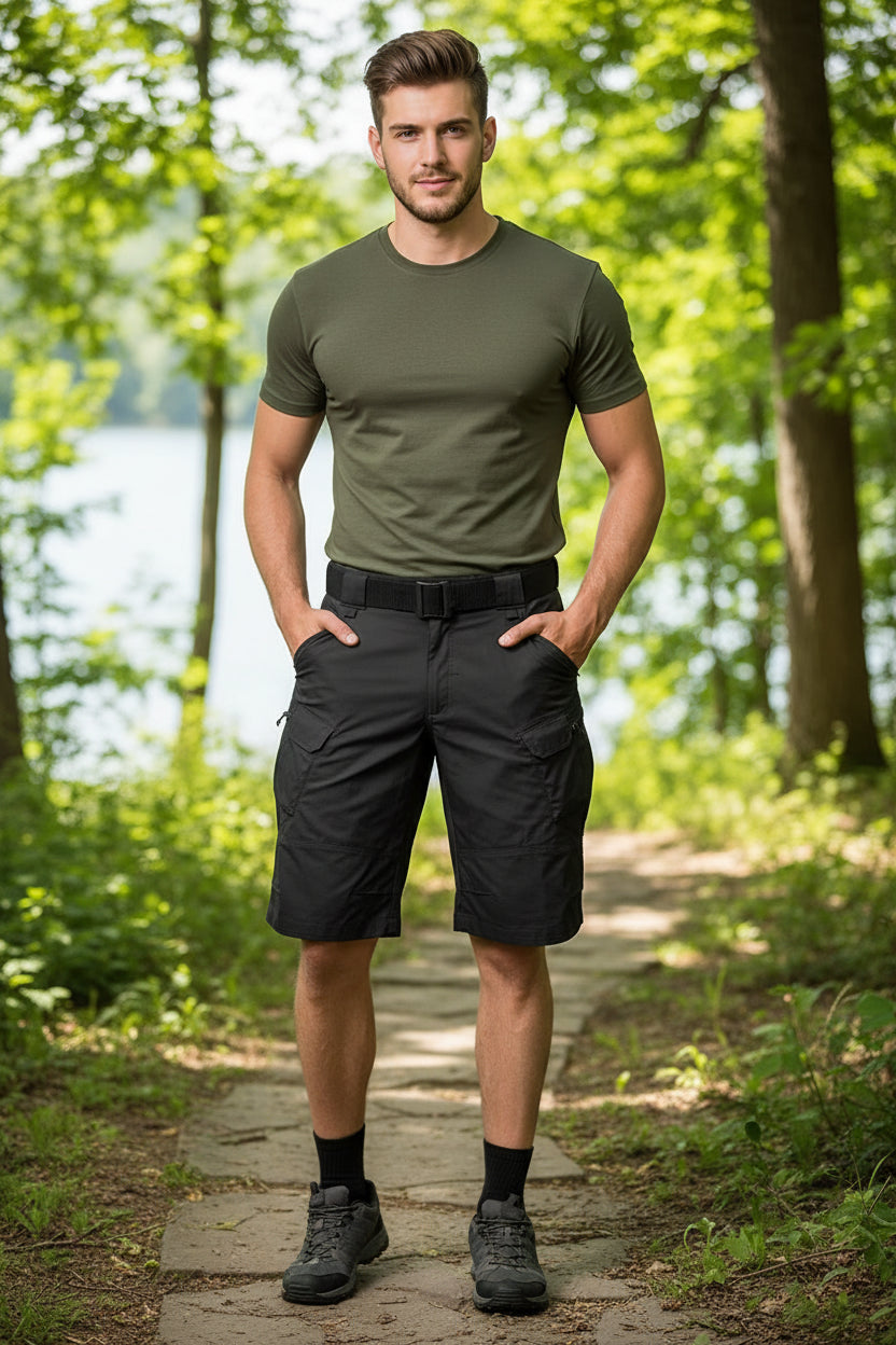 Black tactical shorts with multiple pockets and a belt on a white background