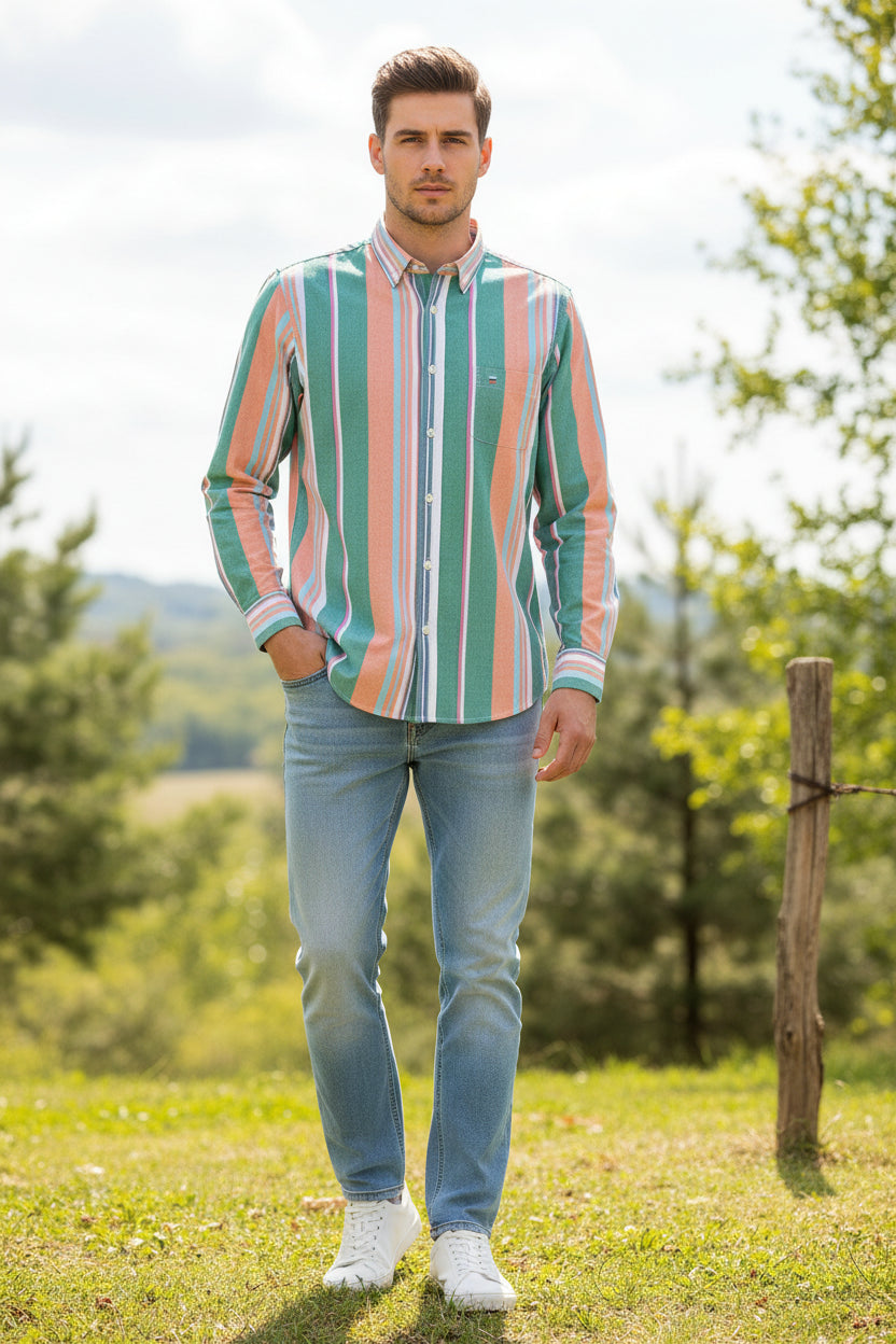 Folded colorful striped shirt with brand logo on a white background