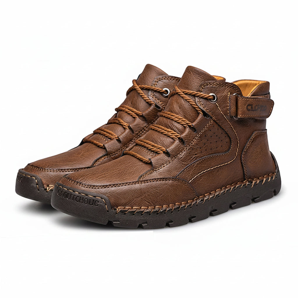 Brown leather boots with brown laces on a white background