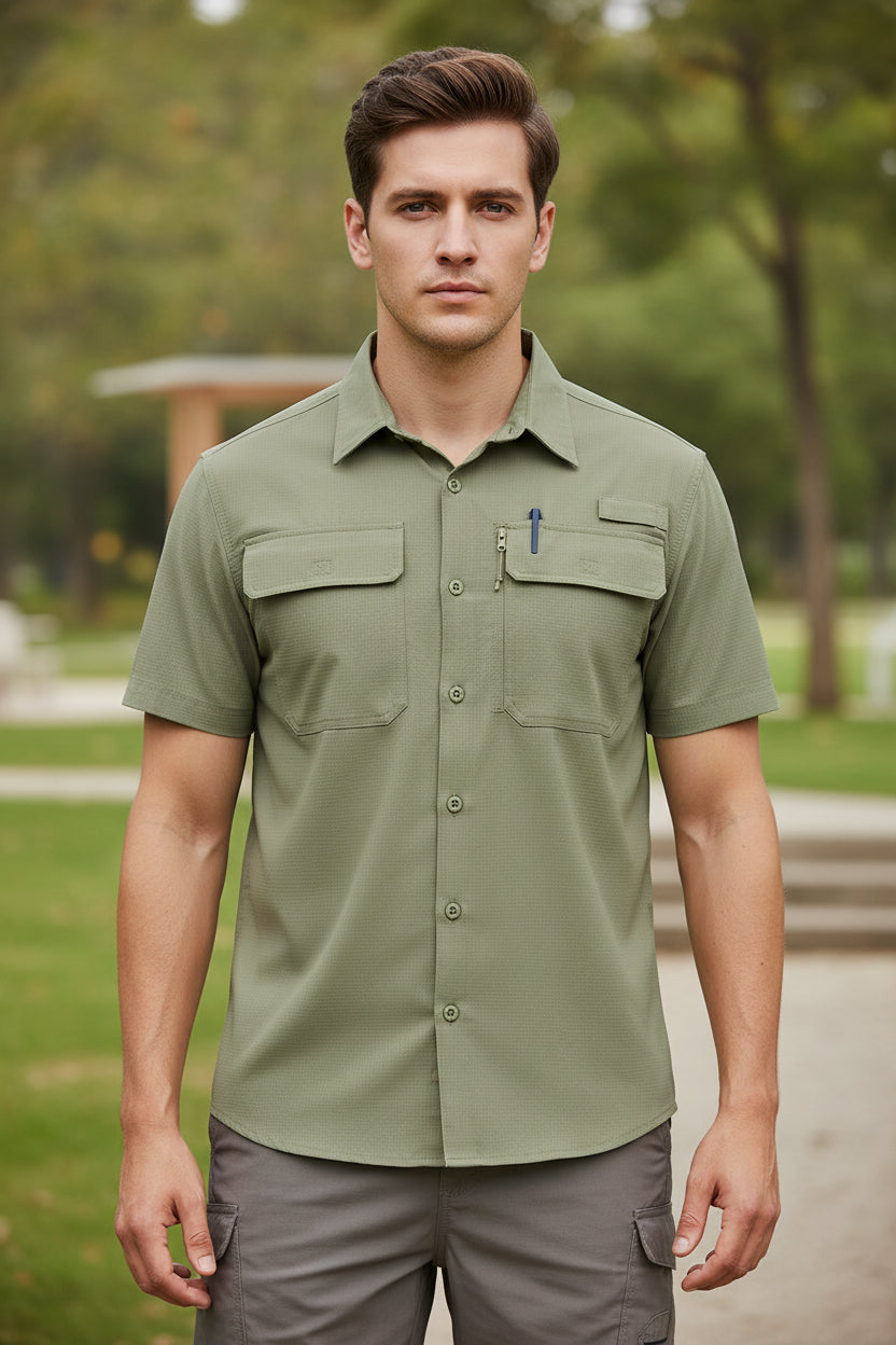 Man wearing a beige short-sleeve shirt with pockets on a white background