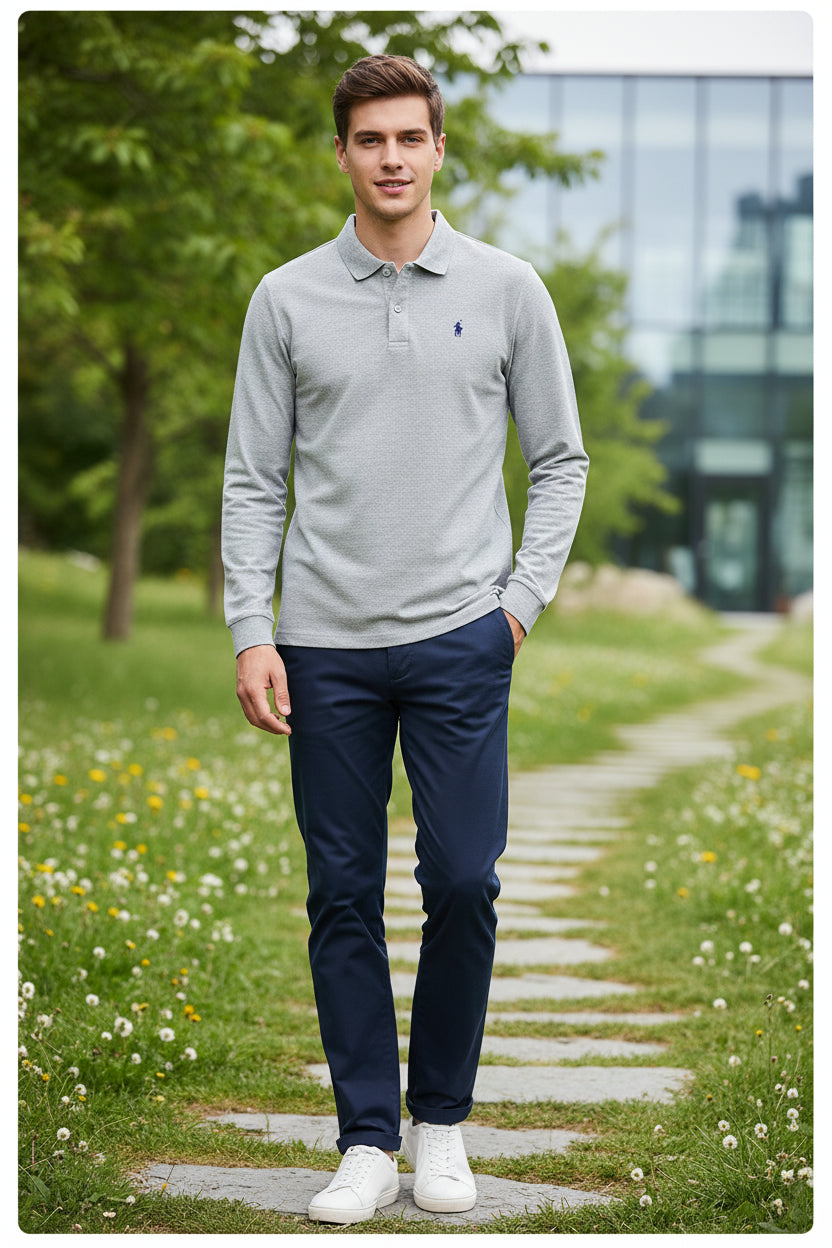 Gray long-sleeve polo shirt with a brand logo on a hanger against a rack of other shirts.