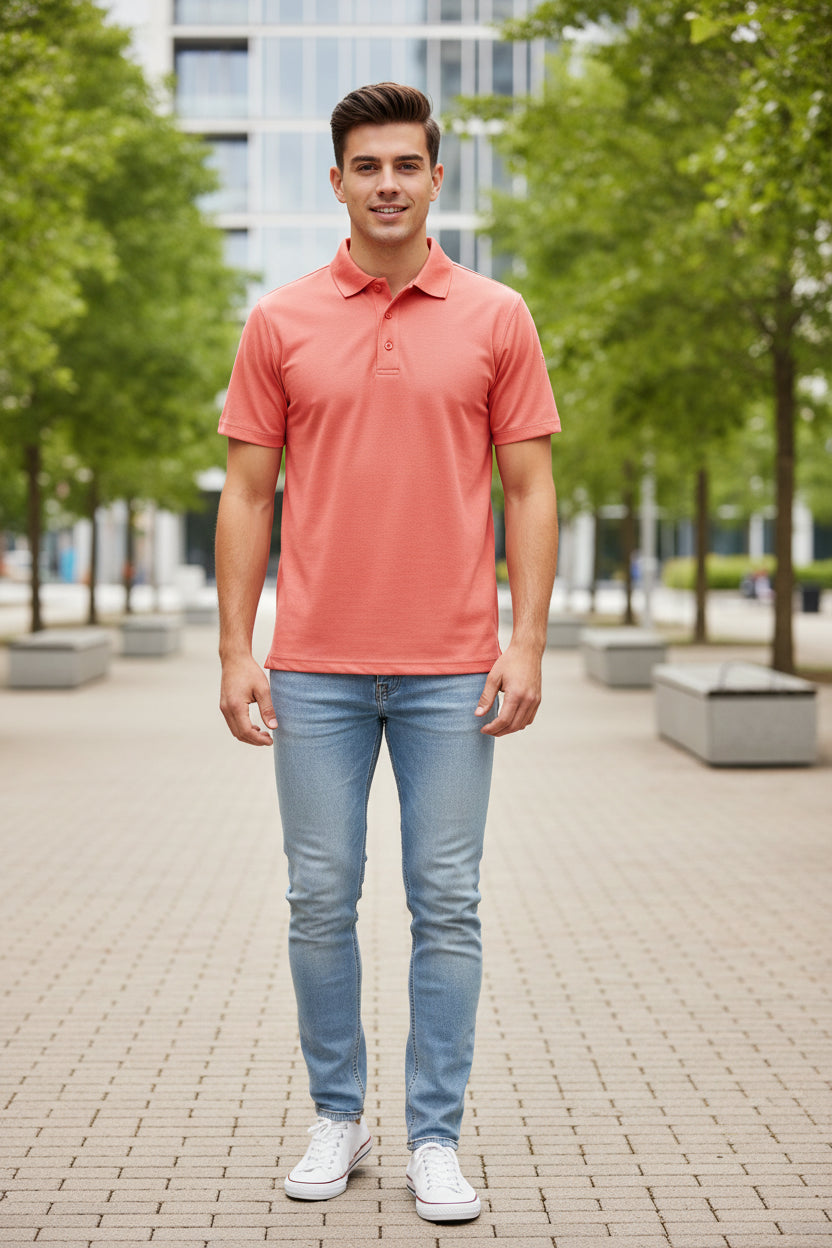 Coral polo shirt on a white background
