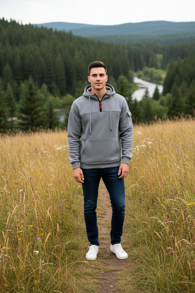 Gray hoodie with a black zipper and red pull tab on a white background