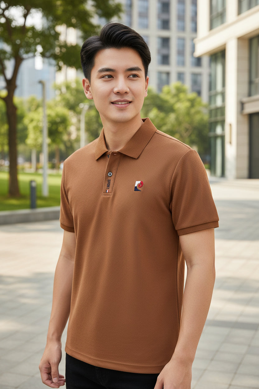 Brown polo shirt with a logo on a hanger