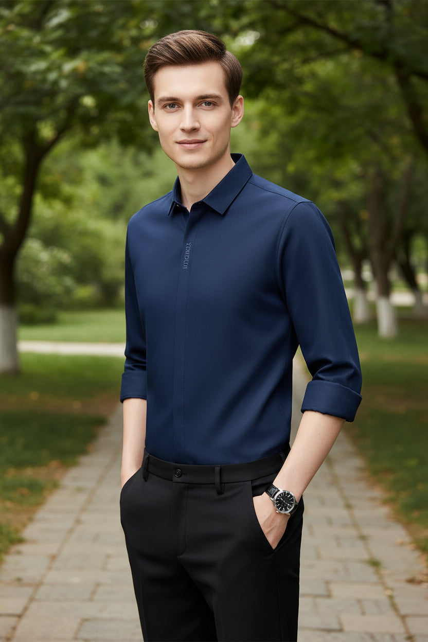 Navy blue dress shirt with rolled-up sleeves on a gray background