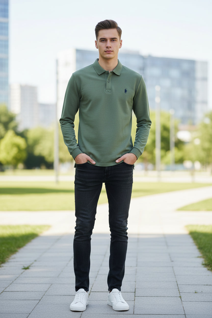 Green polo shirt with a brand logo on a hanger in a clothing store.