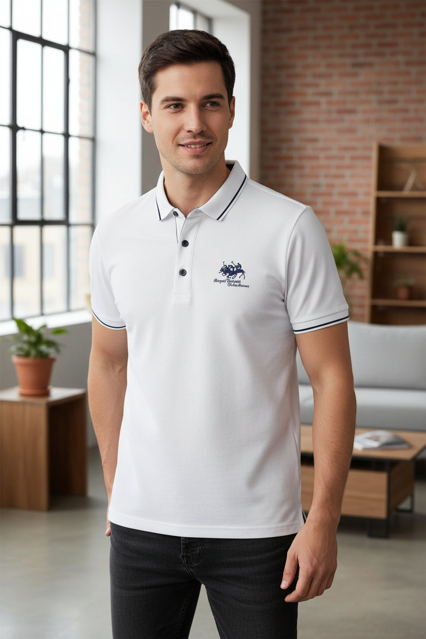 White polo shirt with embroidery on a dark surface