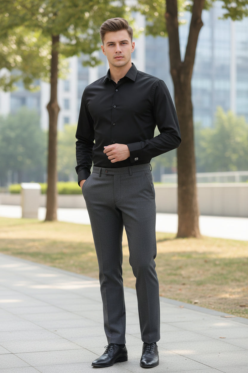 Black dress shirt with cufflinks on a light gray background