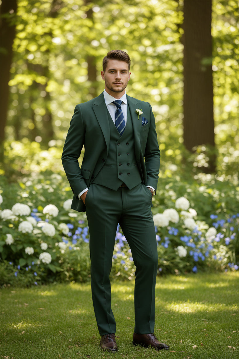 Green suit with striped tie and pocket square on a white background