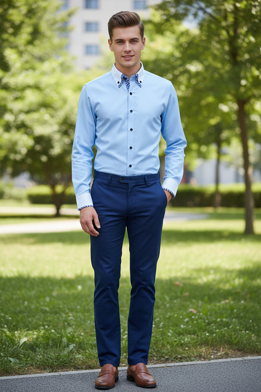 Light blue dress shirt with checkered inner lining on a gray background