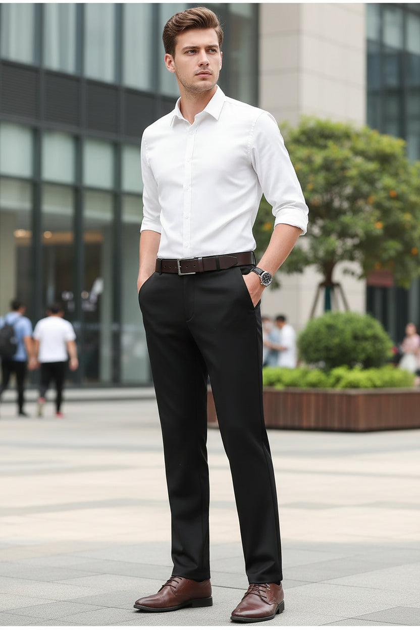 Black dress pants worn with a white shirt and brown shoes on a gray background