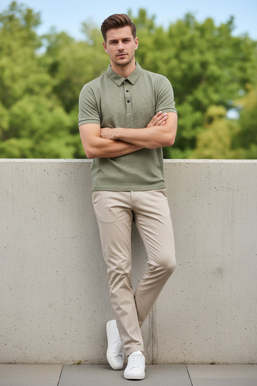 Beige textured polo shirt on a hanger with a white background