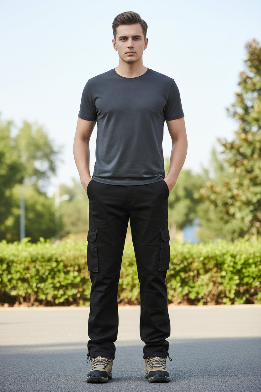 Black cargo pants worn by a person on a white background