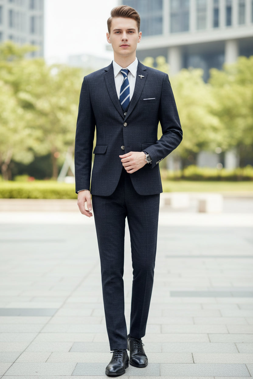 Person wearing a dark suit with a tie in a modern living room.