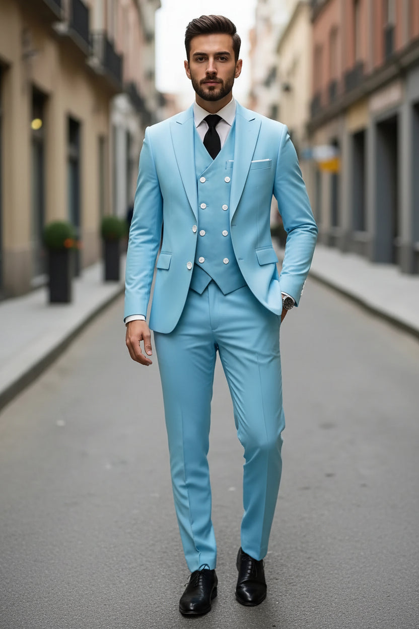 Man wearing a light blue suit with a white shirt and black tie on a city street.