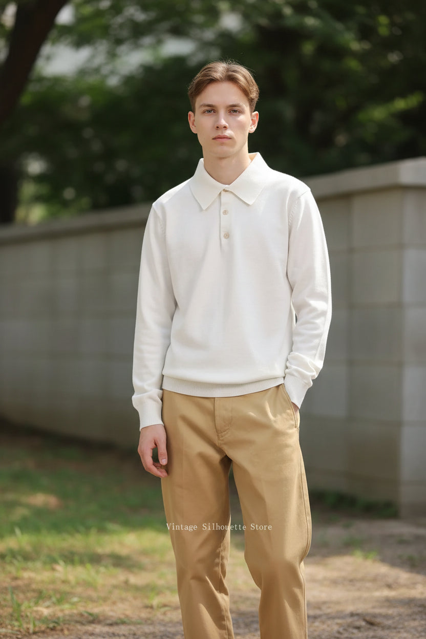 Person wearing a white long-sleeve polo shirt and beige pants against a green background