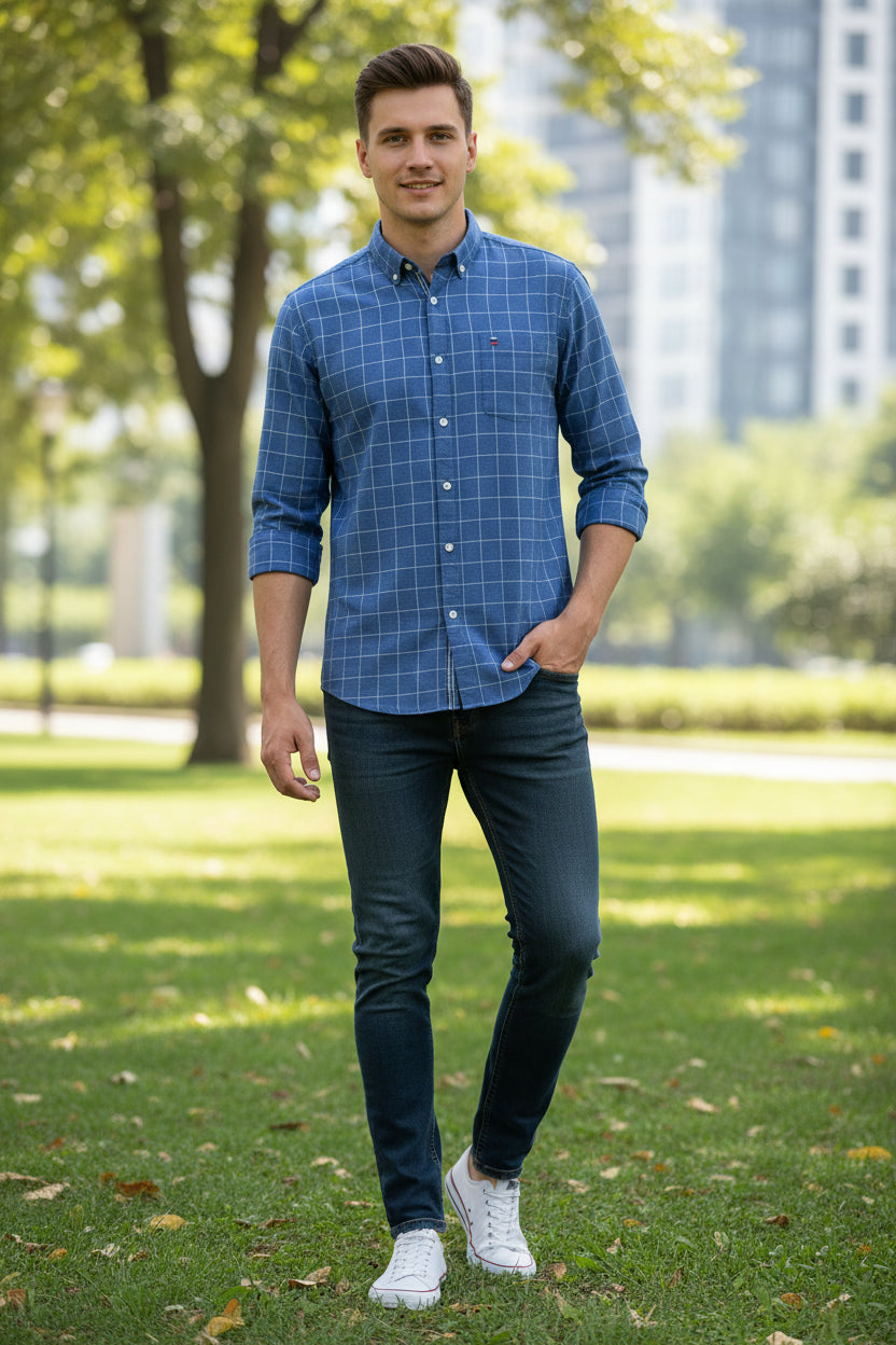Blue checkered shirt with a brand logo on a white background