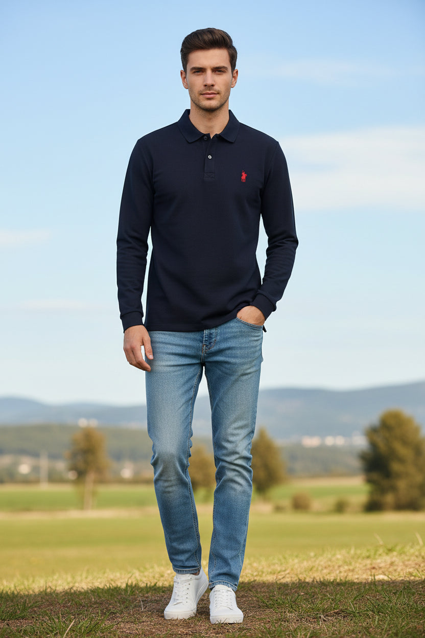 Navy long-sleeve polo shirt with red logo on a hanger against a rack of other shirts.