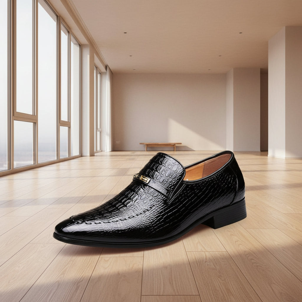 Black crocodile-patterned dress shoe on a white background