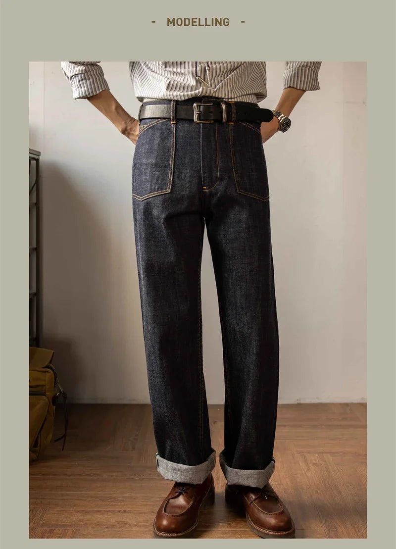 Person wearing dark blue jeans and brown shoes in a minimal indoor setting