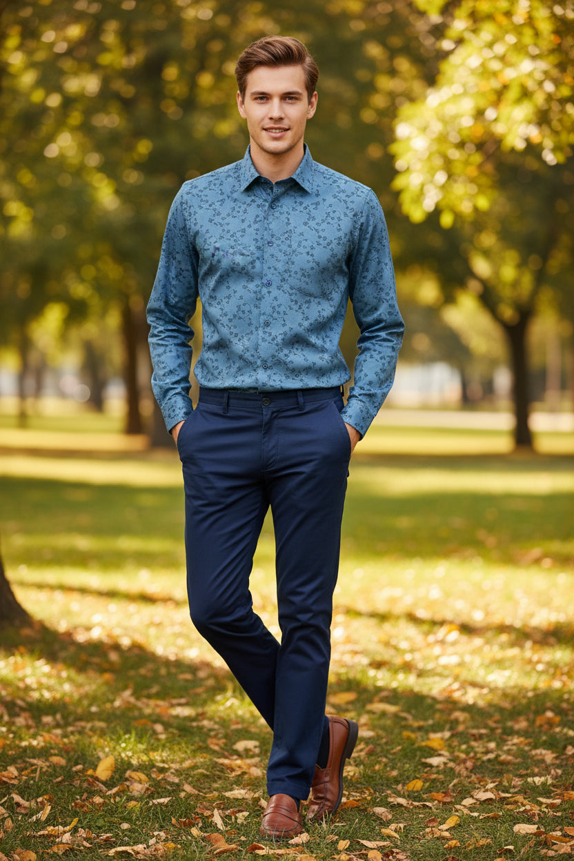 Folded blue shirt with floral pattern on a white background