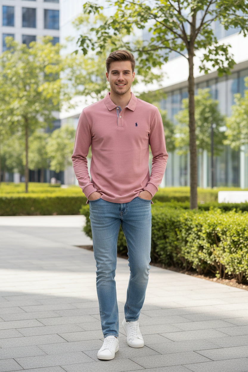Pink long-sleeve polo shirt on a hanger with text 'Relieve Shoulder wrinkles' on a blurred background.