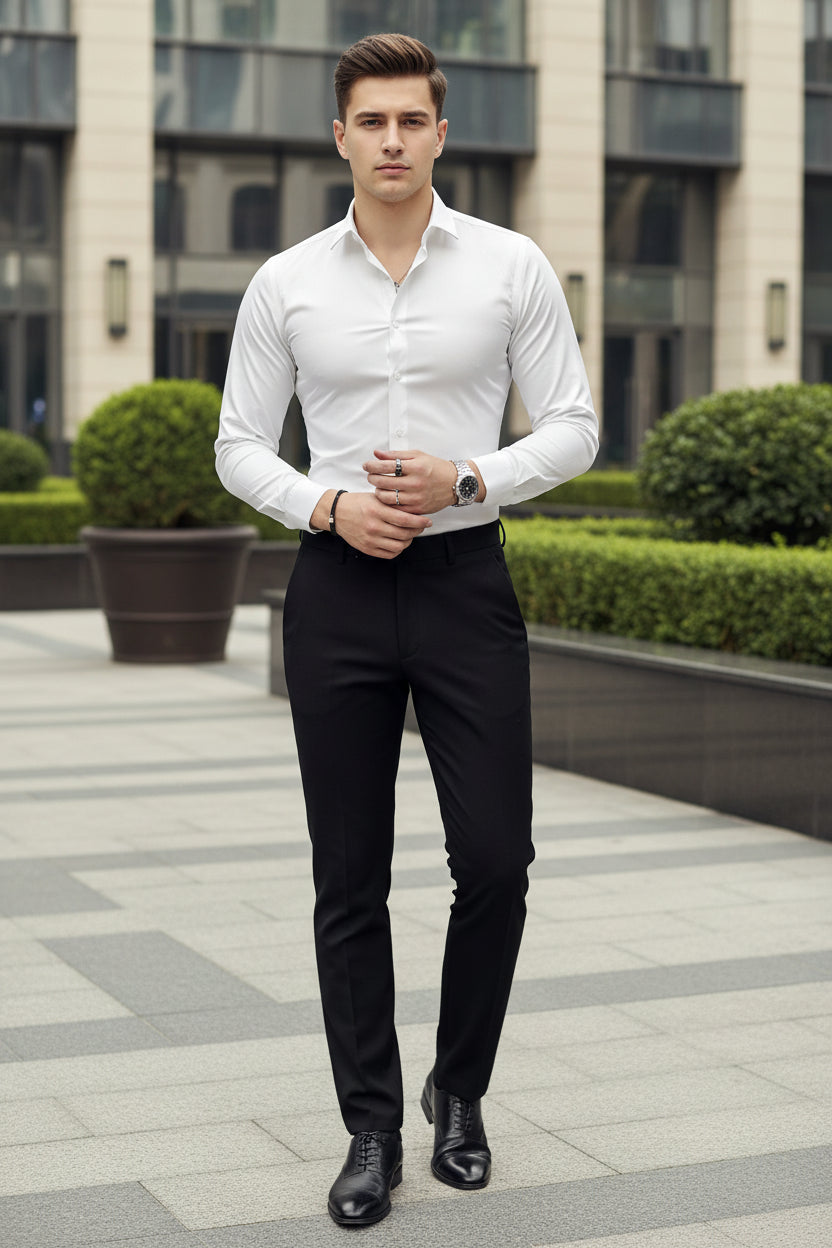 Person wearing a white dress shirt with a blurred background