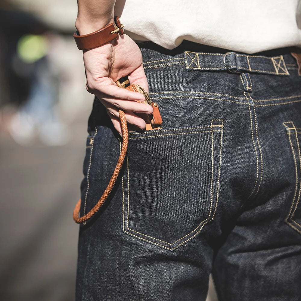 Person wearing blue jeans with a blurred background