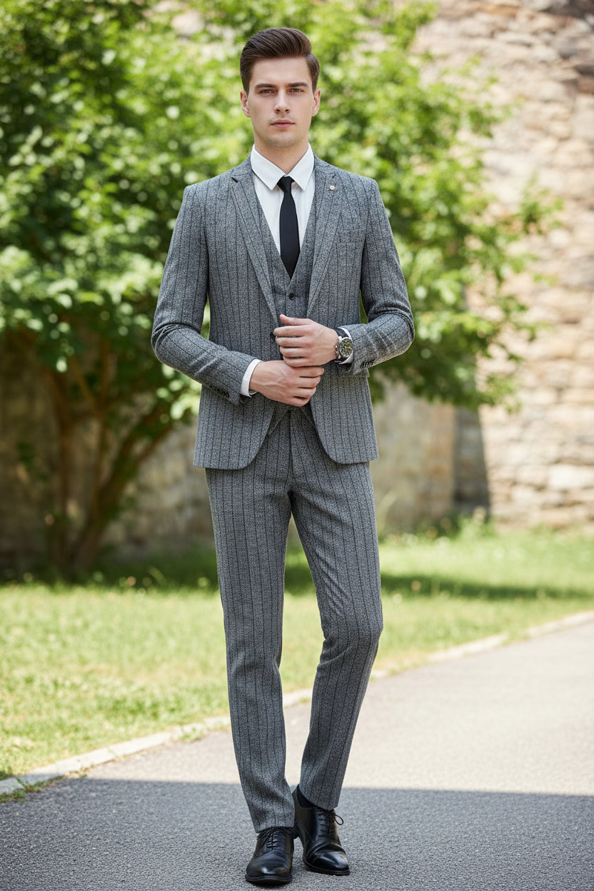 Person wearing a gray suit in a cafe setting