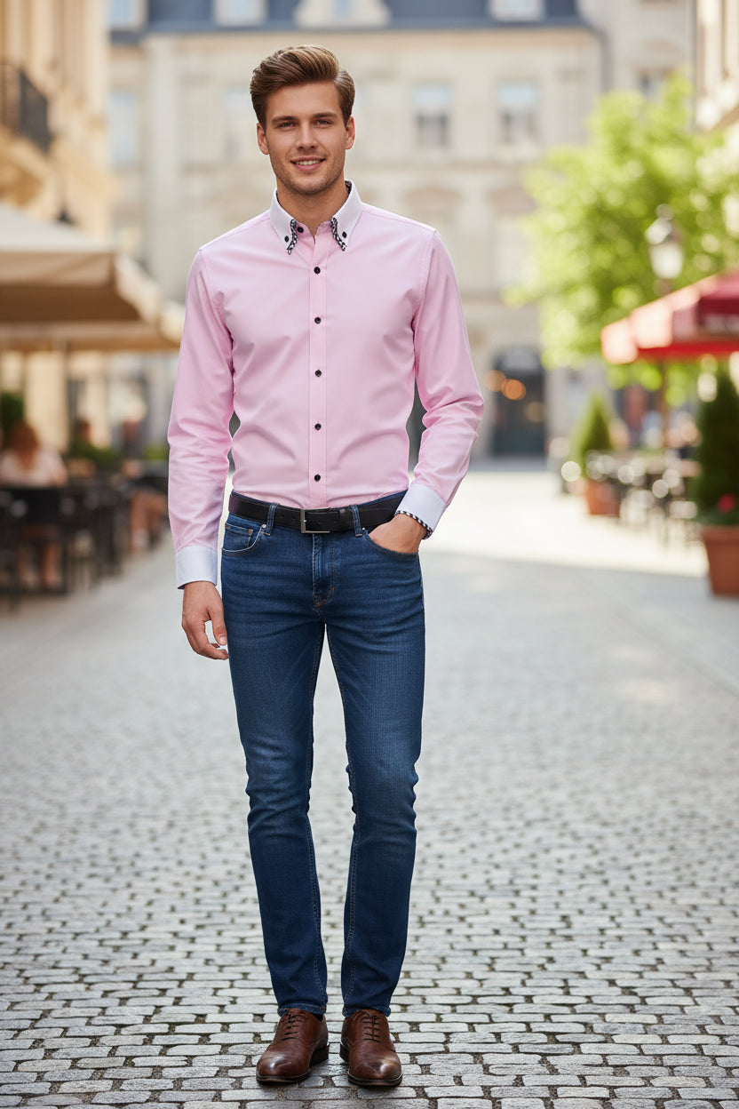 Folded pink shirt with a checkered collar on a gray background