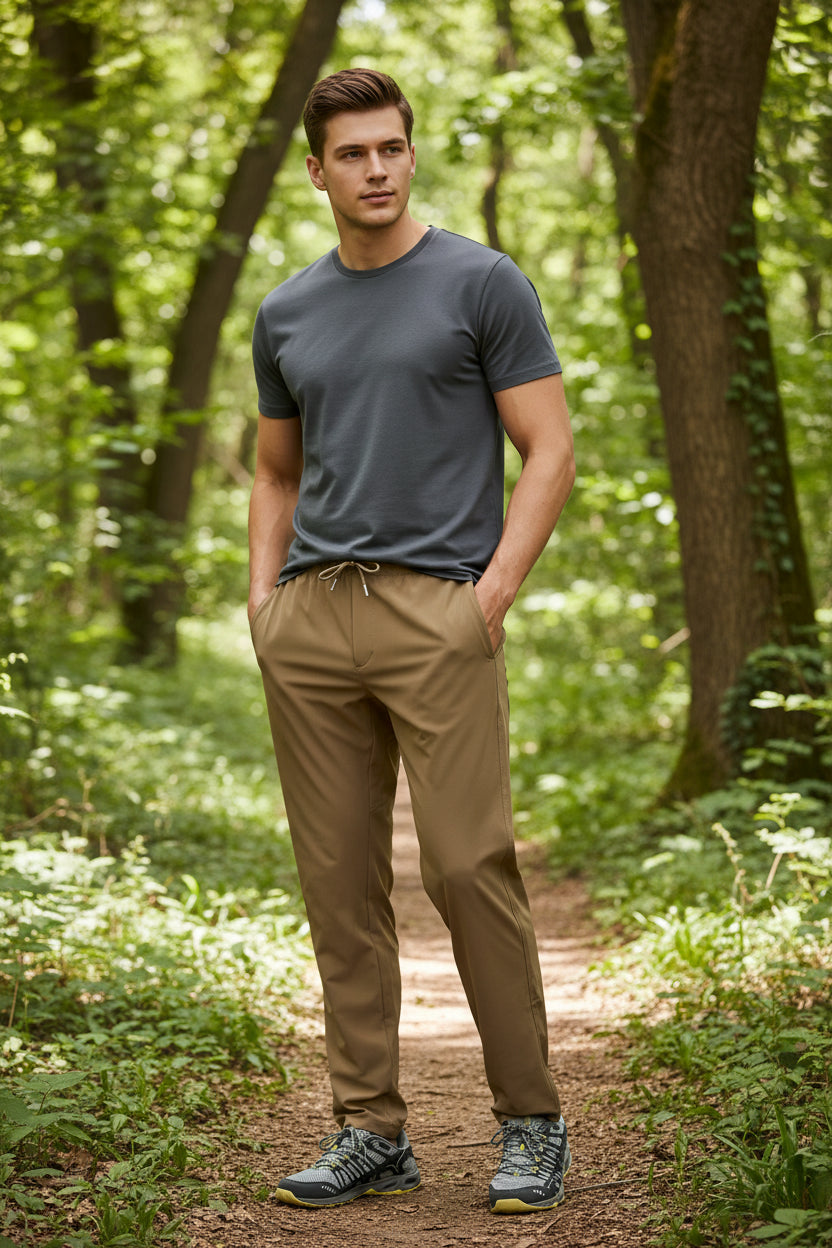 Beige pants worn by a person on a white background